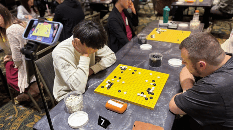Dino Wang 3D (left) plays against Jeremiah Donley 5D in Round 3 of the 2026 Chicago Go Open on May 23, 2026. Photo by Mark Rubenstein.