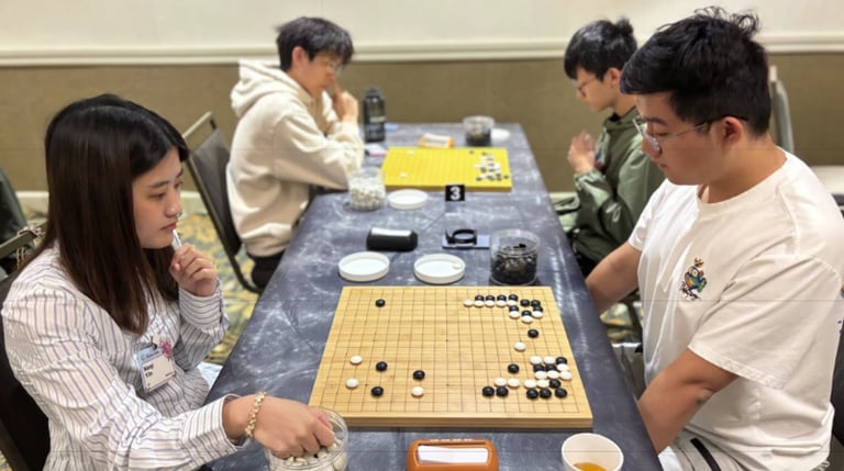 Heqi Yin 5D (left) plays against Haoran Wang 7D (right) in Round 1 of the 2026 Chicago Go Open on May 23, 2026. Photo by Mark Rubenstein.