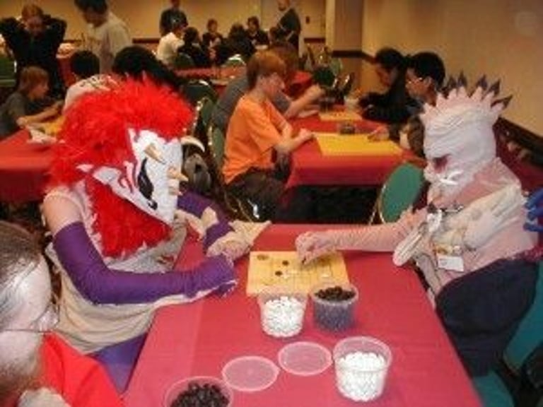 Attendees learn Go at Anime Central in 2006. Barber was among the Evanston Go Club volunteers who taught at the convention. Photo by AGA. Source: https://www.usgo.org/content.aspx?page_id=5&club_id=454497&item_id=112900.